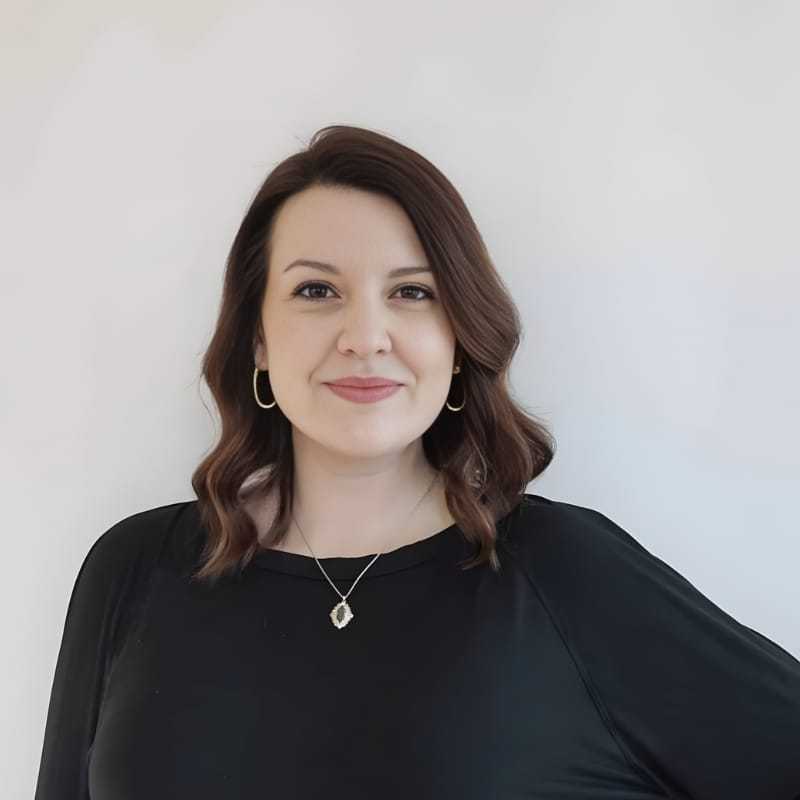 Portrait of Cara R., a professional stylist at Mouton's Salon, showcasing their expertise and style.