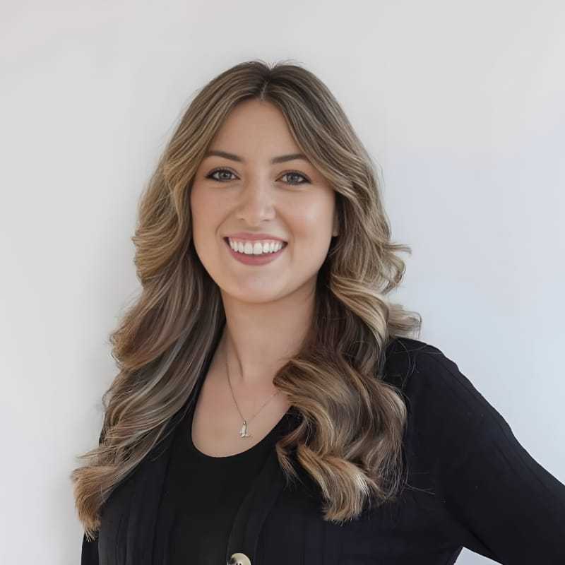 Portrait of Victoria V., a professional stylist at Mouton's Salon, showcasing their expertise and style.