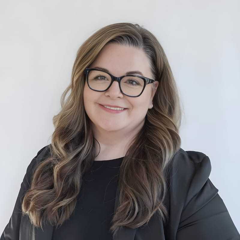 Portrait of Sherri L., a professional stylist at Mouton's Salon, showcasing their expertise and style.