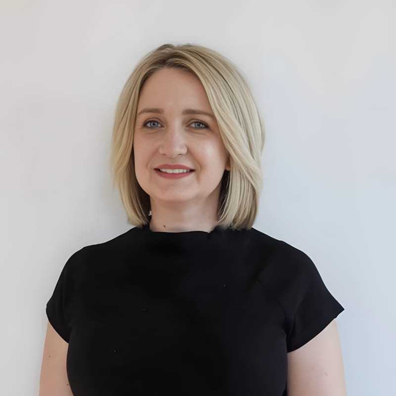 Portrait of Carrissa B., a professional stylist at Mouton's Salon, showcasing their expertise and style.