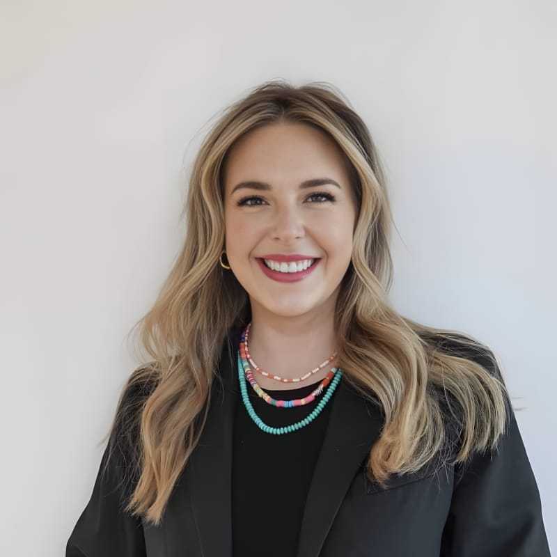 Portrait of Kaylee Q., a professional stylist at Mouton's Salon, showcasing their expertise and style.