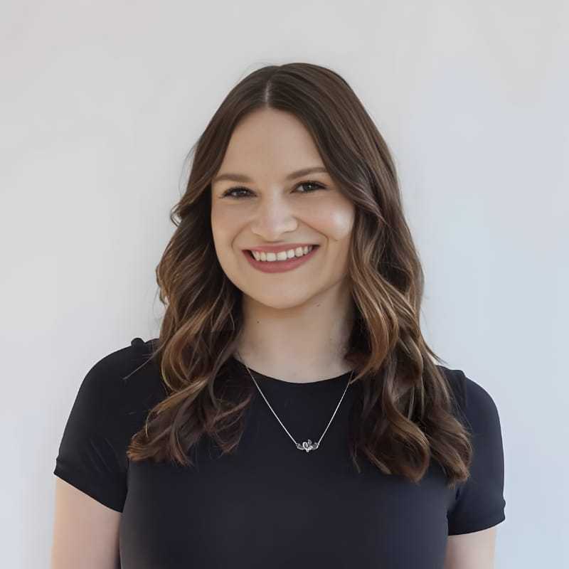 Portrait of Lily C., a professional stylist at Mouton's Salon, showcasing their expertise and style.