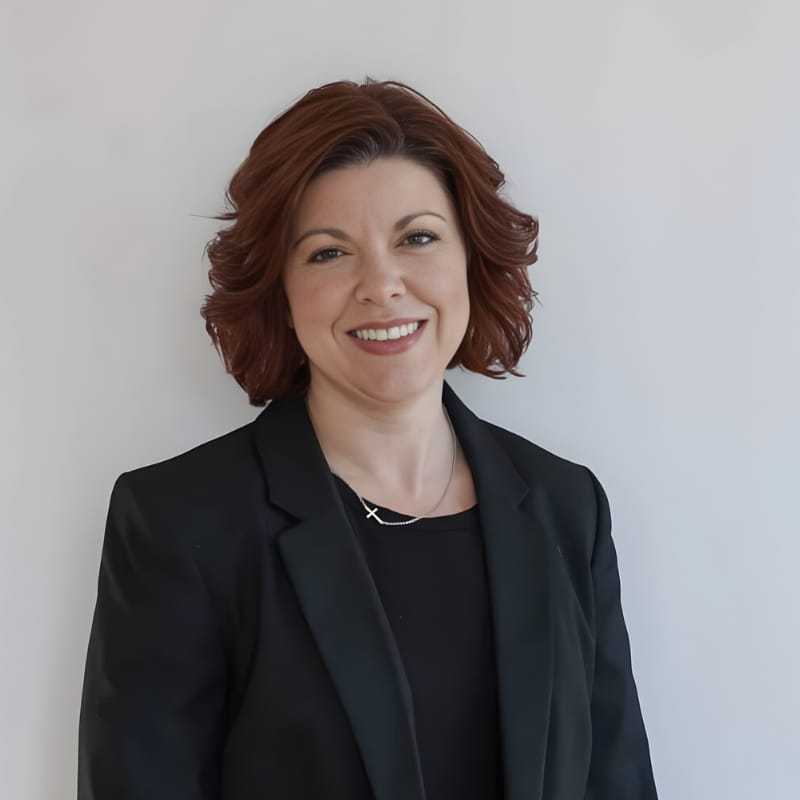 Portrait of Ashley P., a professional stylist at Mouton's Salon, showcasing their expertise and style.